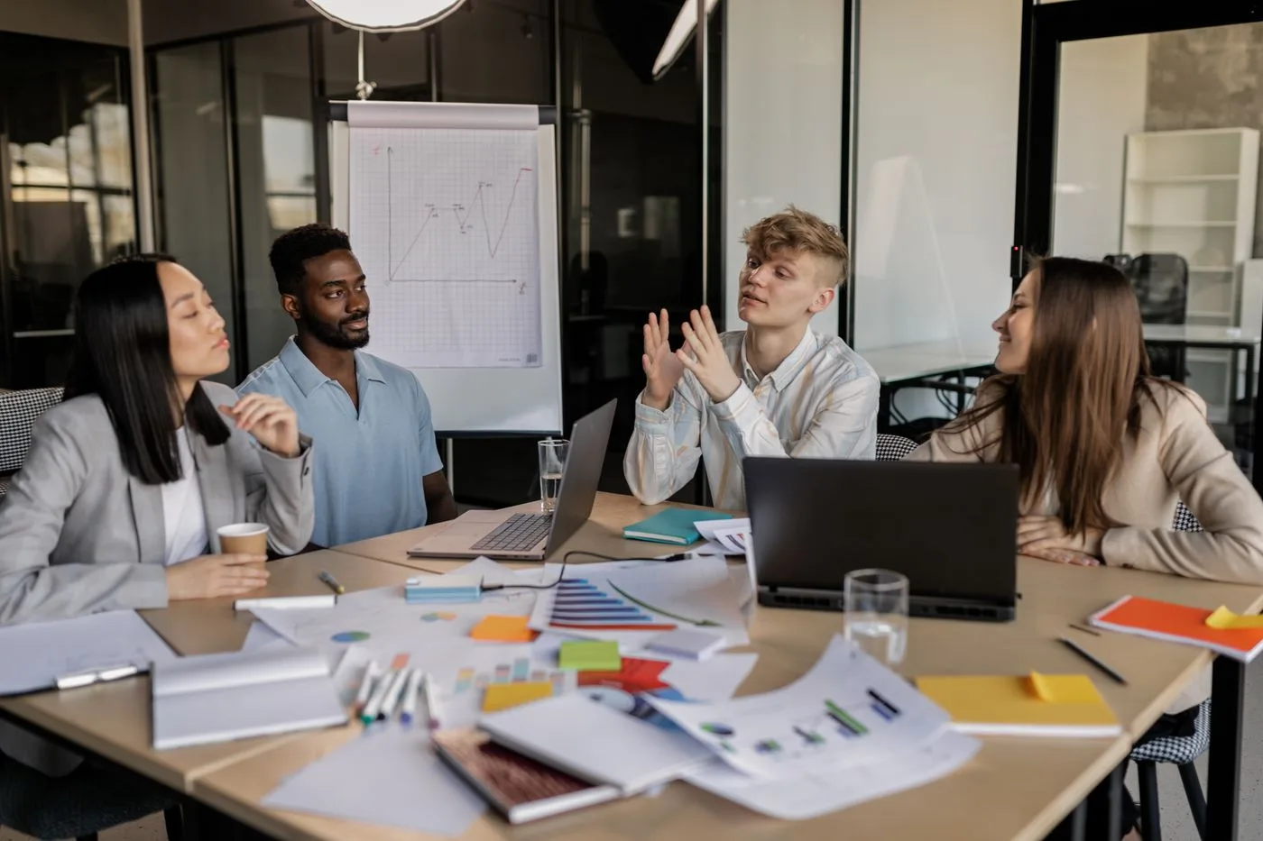 A small group collaborating around ideas in a meeting